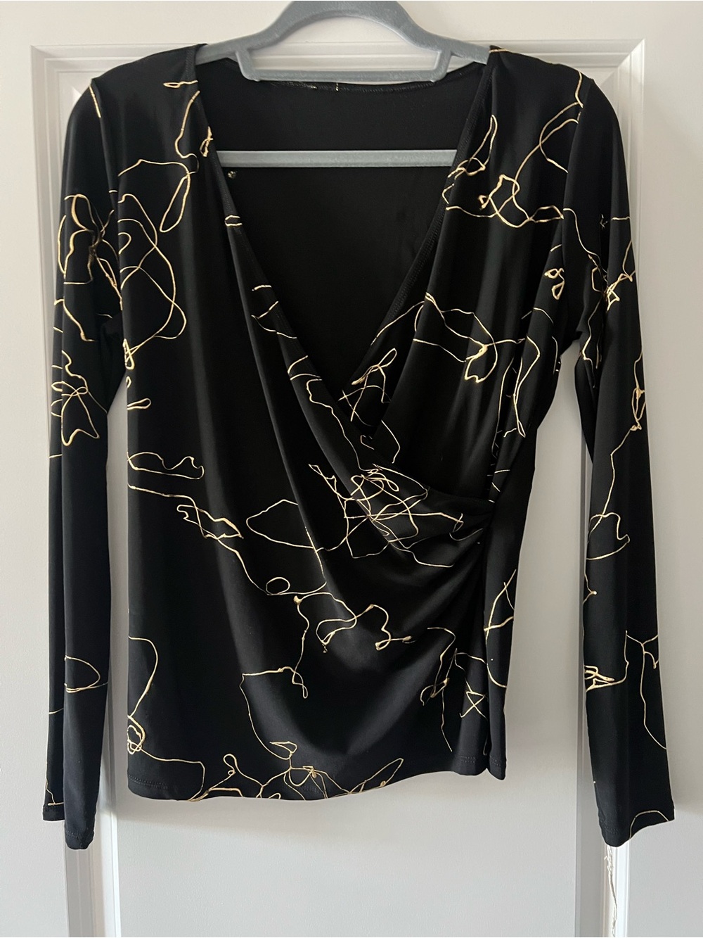 Black Long-Sleeve Faux-Wrap Blouse with Gold Line Print